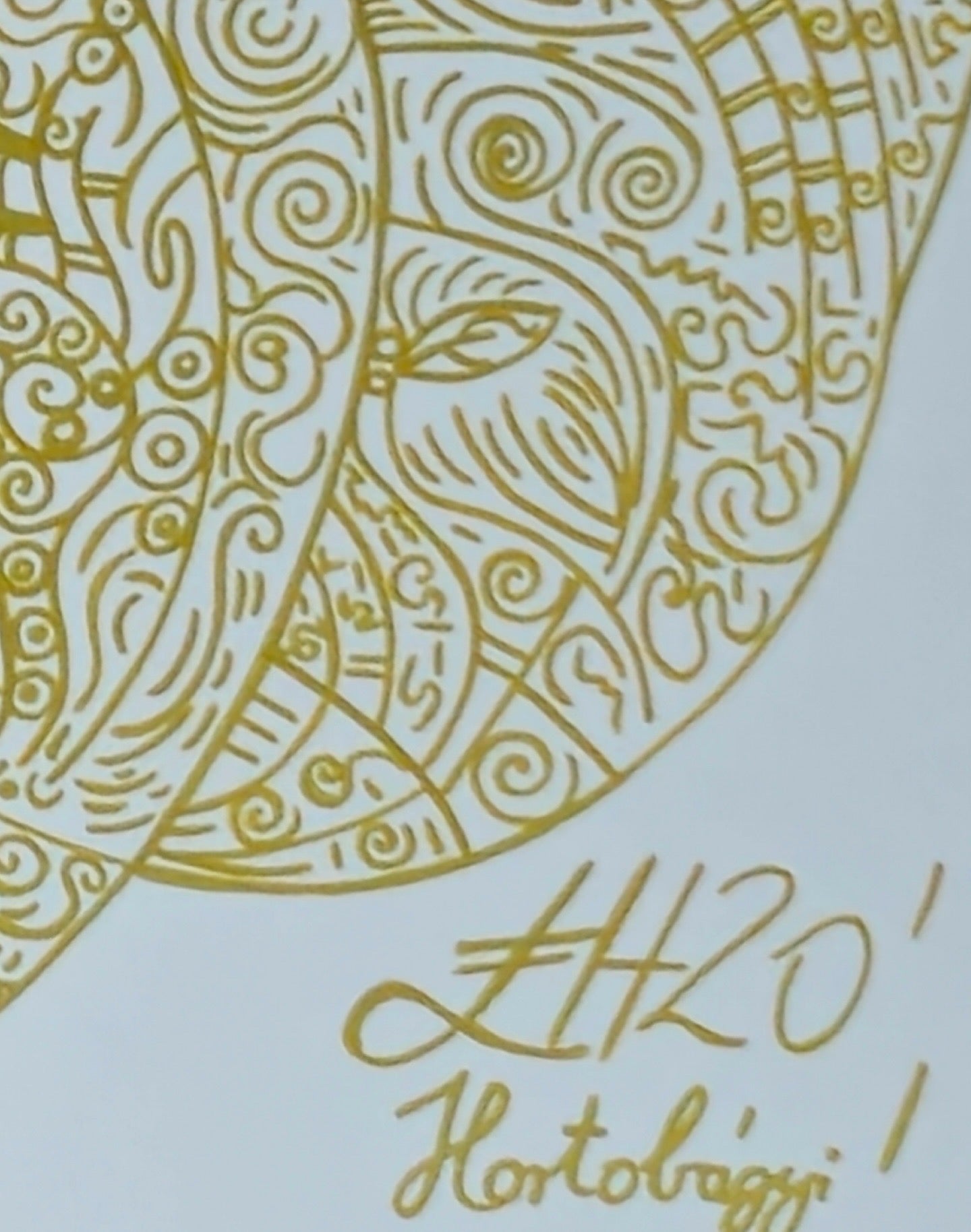 Golden pen signature on canvas