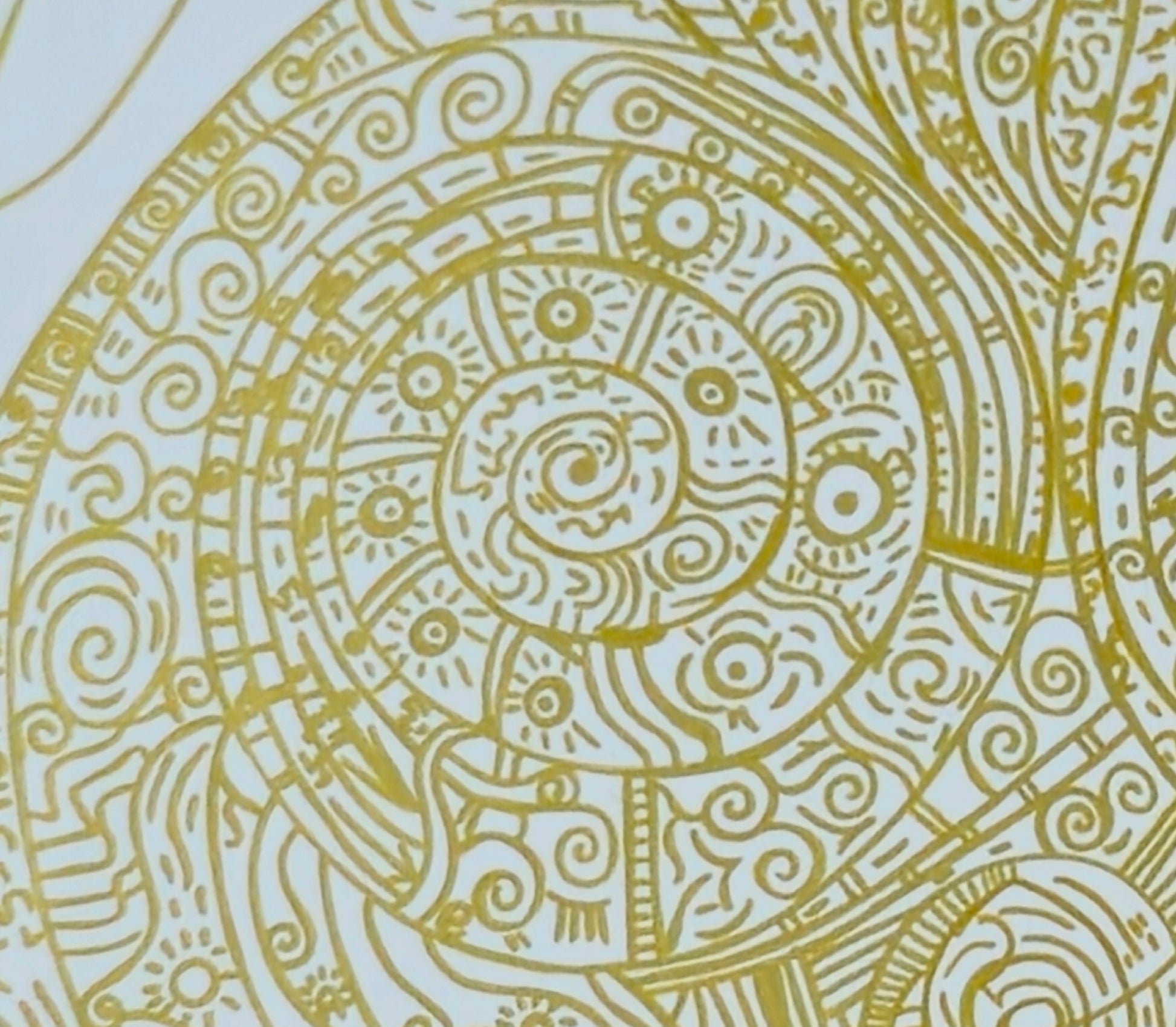Circular pattern drawn with golden pen 